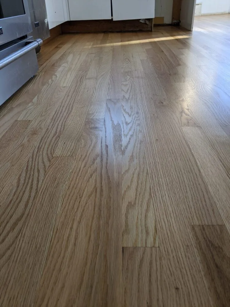 Before picture of Bona Traffic HD finish applied to refinished oak flooring