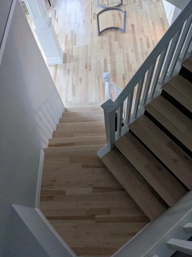 Refinished wooden staircase by Revive Hardwood